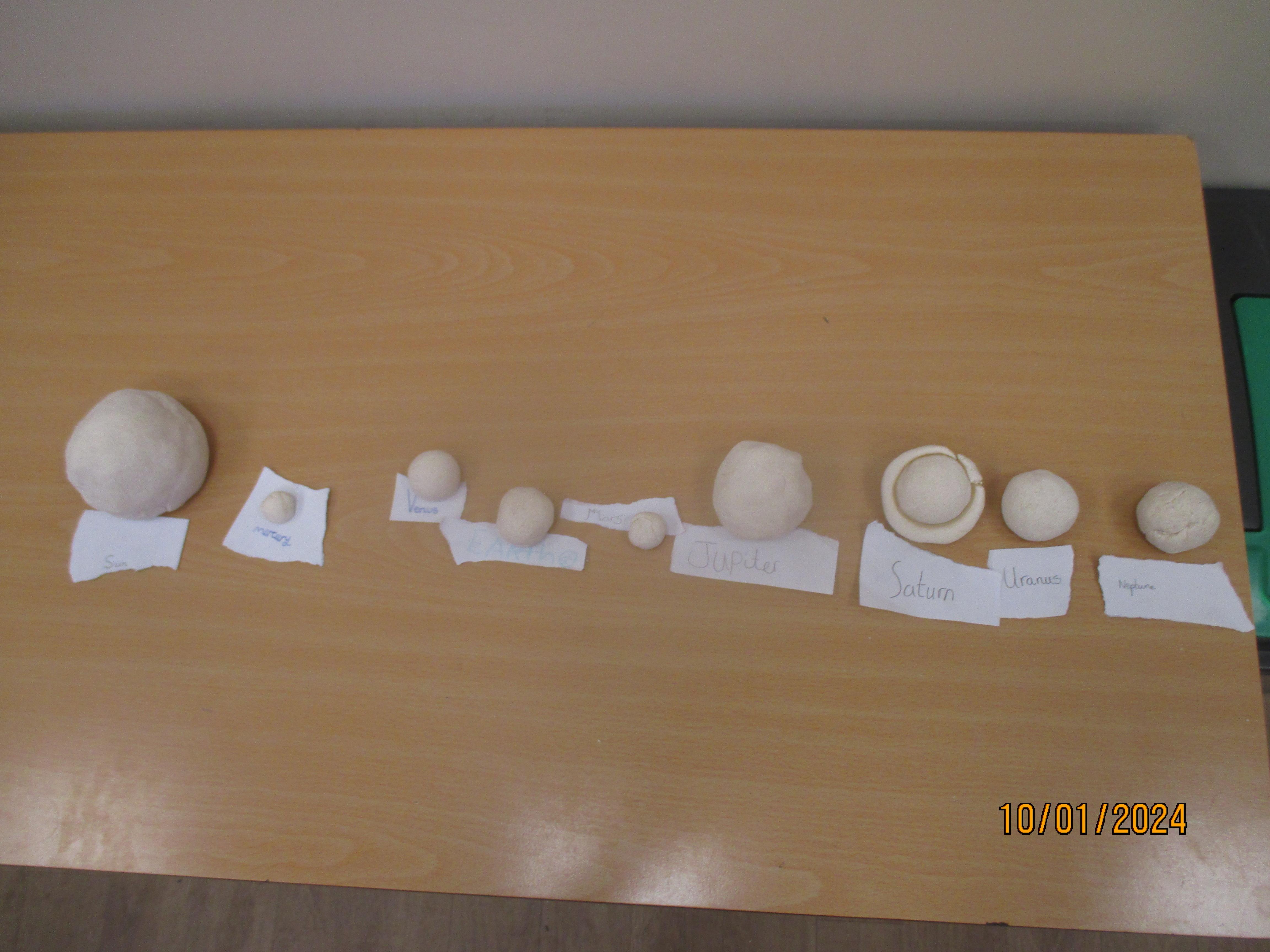 Year 5 used salt dough to create the planets and order them, relative to the Sun.